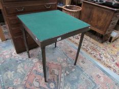 A folding Vono card table, (label to underside).