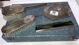 A cased silver backed vanity set comprising brushes, comb etc with Birmingham hall mark.