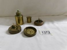 2 brass compass's and a brass wick lamp.