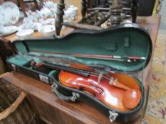 A cased violin and bow.