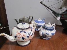 3 blue and white teapots and a silver plated teapot.