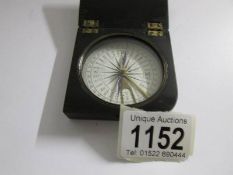 An early 20th century bakelite cased compass by Kemp & Co., Edinburgh.