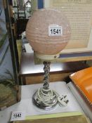 An art deco chrome table lamp.
