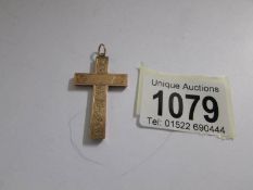 A 9ct gold cross hall marked Chester 1915/16.