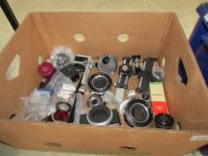 A box of vintage camera shutters, top quality enlarger lens etc.
