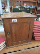 A 1930's oak cabinet for 78 rpm records.