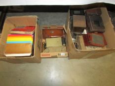 3 boxes containing photographic equipment including parts for old plate camera, brass lenses,