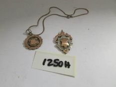 A watch fob dated Birmingham 1928, silver with gold front along with another dated Birmingham 1929,