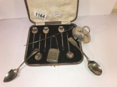 A mixed lot of silver including match holder, spoons etc (cased set missing one spoon).