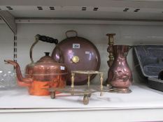 A copper kettle, a copper footwarmer and other items.