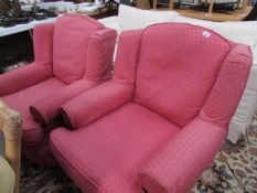 A pair of pink armchairs.