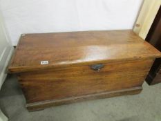 A rare sea captain's trunk with tapered sides, rope handles and alarm bell in lock.