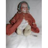 A bisque headed doll marked AM.