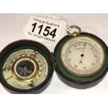 A 19th century cased pocket barometer with compass and ivory scale inside lid (thermometer missing).