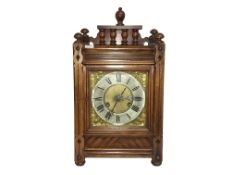 An oak cased mantel clock with 3 stars marked to mechanism.