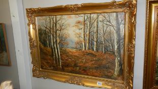 An oil on canvas woodland scene signed D A Everitt in gilt frame.