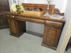 A Victorian double pedestal mahogany sideboard.