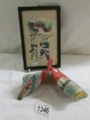 A pair of 19th century Chinese children's shoes and a framed and glazed Chinese dragon festival