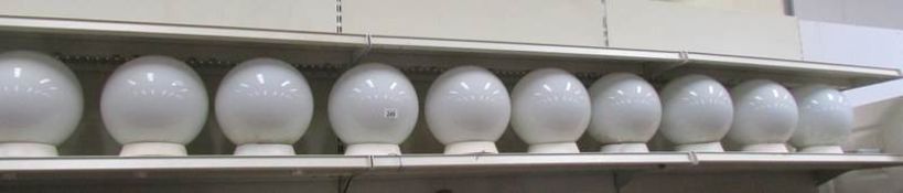 10 opaque glass globe shaped industrial ceiling lights.