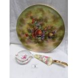 A Royal Crown Derby posies tea strainer with drip tray and a Royal Winton fruit decorated cake