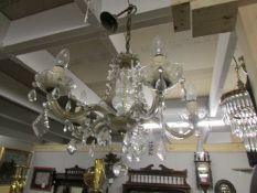 A 5 lamp glass chandelier.