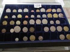 A collector's tray of assorted old coins.