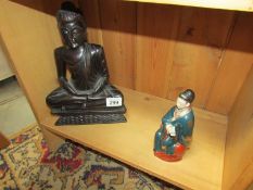 A Buddha and a Chinese figure.