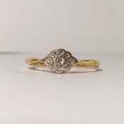 An art deco ring set with 9 diamonds, stamped platinum and 9ct gold, dated inside chank 24/12/27.