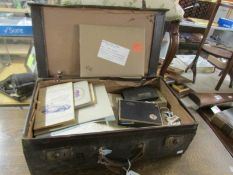 A suitcase of miscellaneous ephemera including cigarette cards, county maps, Harmsworth prints,