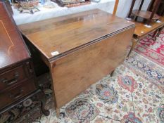 A Victorian drop leaf dining table.