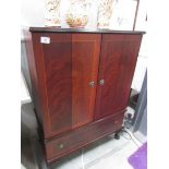 A mahogany effect television cabinet.