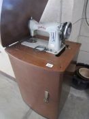 A Jones cabinet sewing machine,.