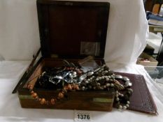 A jewellery box containing a mixed lot of costume jewellery.