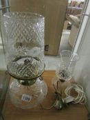 A cut glass electric table lamp and a smaller example.