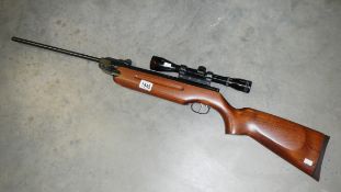 An air rifle with sight marked Simmons.
