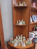A collection of rabbit and clown figures,.