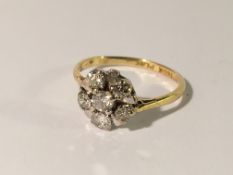 A circa 1960/1970s diamond cluster ring set with 6 diamond, stamped 18ct gold and platinum,