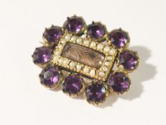 A Georgian amethyst and pearl set brooch in gold.