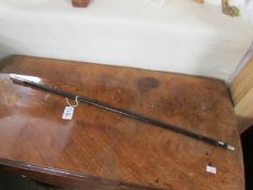 A St. John's Ambulance Brigade swagger stick with silver mounts.