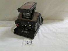 A Polaroid SX-70 land camera, model 3.