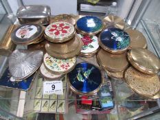 In excess of 30 vintage powder compacts.