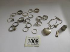 A quantity of silver rings, pendant etc.