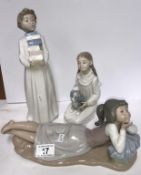 3 NAO figures being boy carrying books, girls petting a puppy and a girl in reclining position.