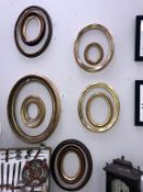 8 oval ornate gilt picture frames.