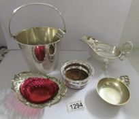 A silver plated ice bucket, wine coaster, wine taster,
