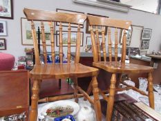 A pair of kitchen chairs.