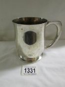 A 19th century silver plated tankard with an 1890 Victorian silver crown set in base.