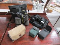 4 pairs of binoculars and a camera.