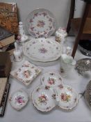 An assortment of 10 pieces of floral decorated china,