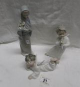 2 LLadro angels and a Lladro lady carrying lilies.